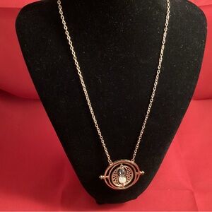 Gold tone sandglass necklace